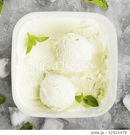 Mint ice cream in bowl on a gray background Mint ice cream in bowl on a gray background 32923479