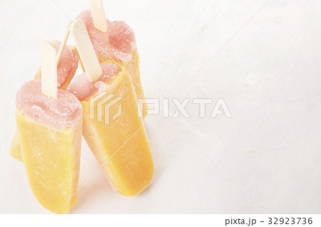 Multi-colored popsicles on a white background 32923736