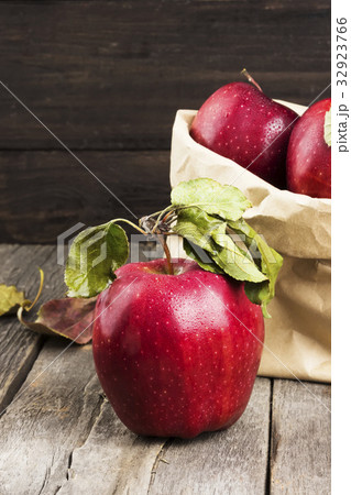 Apples in paper package on a dark background Apples in paper package on a dark background 32923766