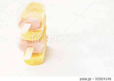 Multi-colored popsicles on a white background 32924148