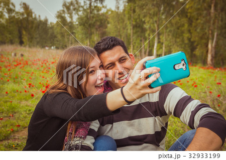 Couple taking selfie picture Couple taking selfie picture 32933199