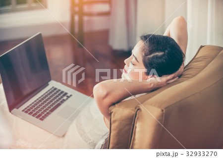 Woman resting after work hard with laptop computer 32933270