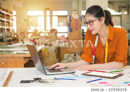 fashion asian designer using computer 32936349