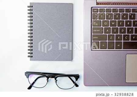 Top view of business working place with notepad, 32938828