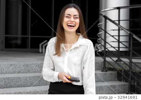 fun amazing brunette in a white shirt standing on 32941691