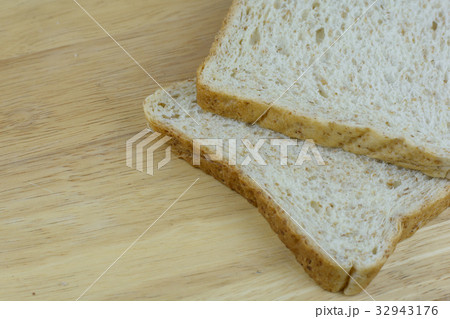 Bread whole wheat on wood background Bread whole wheat on wood background 32943176