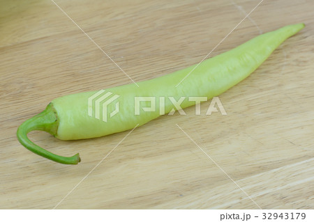 green chilli on wood background 32943179