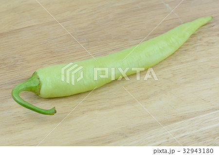 green chilli on wood background 32943180