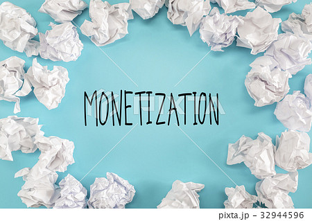 Monetization text with crumpled paper balls  32944596