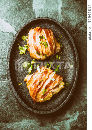Chicken wrapped in bacon. Top view Chicken wrapped in bacon. Top view 32945814