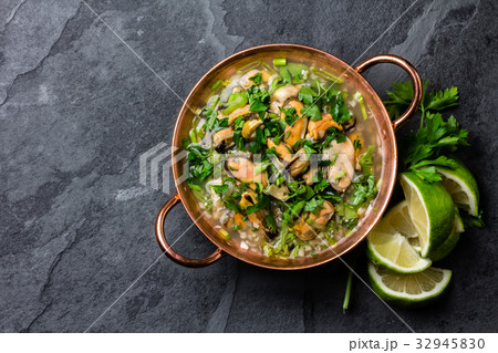 Peruvian food. Mussels ceviche. Cold soup with 32945830