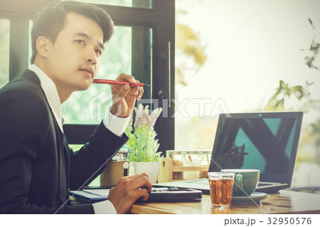 Business man using portable laptop computer Business man using portable laptop computer 32950576