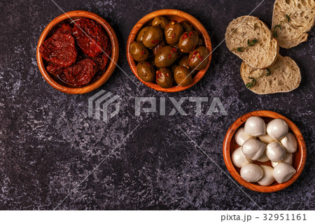 Fresh bread with snacks. 32951161