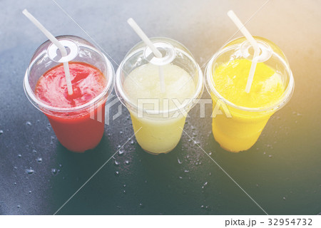 Colored Smothies Take Away in Plastic 32954732