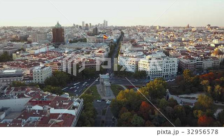 Fly over the evening Madrid with a view of the 32956578