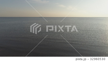 Aerial shot over baltic sea in bright sunset time Aerial shot over baltic sea in bright sunset time 32960530