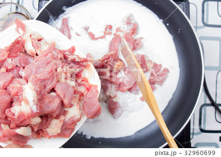 Chef putting slice of beef for cooking Chef putting slice of beef for cooking 32960699