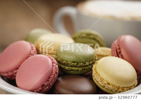 mixed macarons in bowl closeup shot 32960777