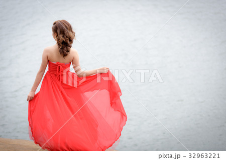 red evening dress enjoying on the mountain. red evening dress enjoying on the mountain. 32963221