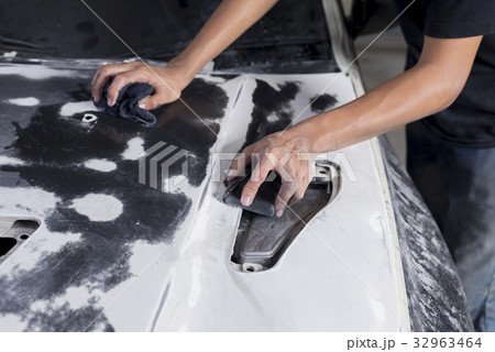 Auto body repair series: Mechanic wet-sanding hood 32963464