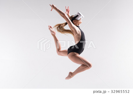 Serious youthful fit woman doing exercise with 32965552