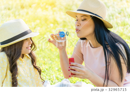 Happy mother having playtime with her child on Happy mother having playtime with her child on 32965715