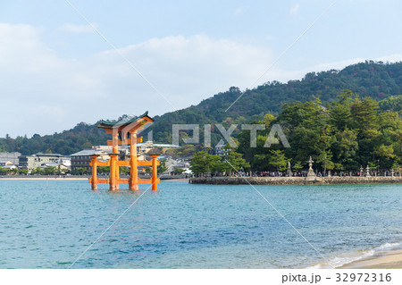 Giant floating Shinto torii gate of the Itsukushima Shrine Giant floating Shinto torii gate of the Itsukushima Shrine 32972316