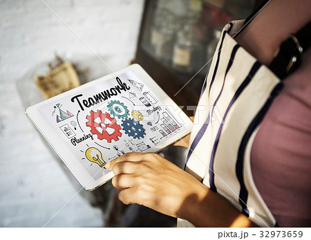 Hand working on digital device network graphic overlay 32973659