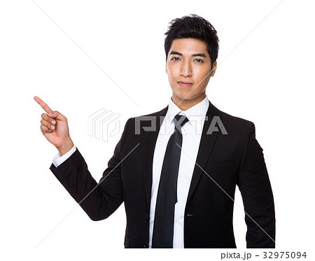 Young businessman showing finger up Young businessman showing finger up 32975094