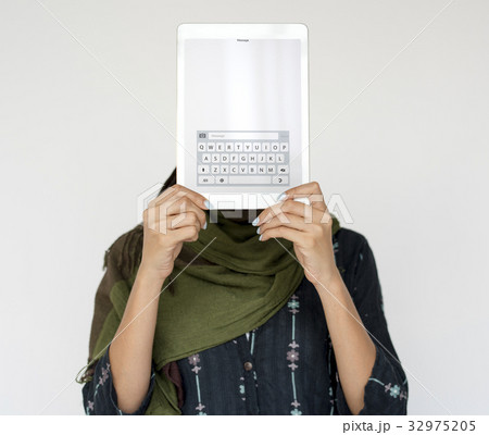 Woman holding network graphic overlay digital device covering face 32975205