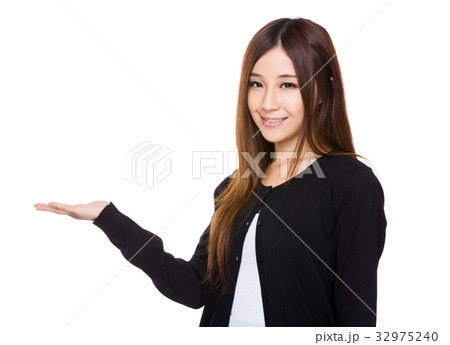 Asian young woman with open hand palm Asian young woman with open hand palm 32975240