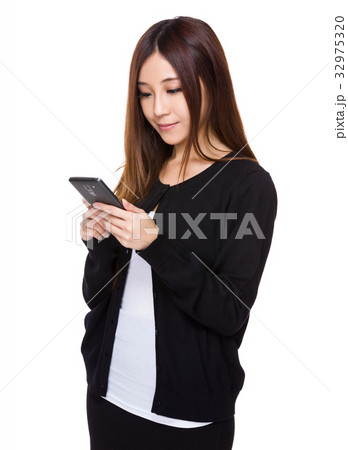 Asian woman read on the mobile phone Asian woman read on the mobile phone 32975320