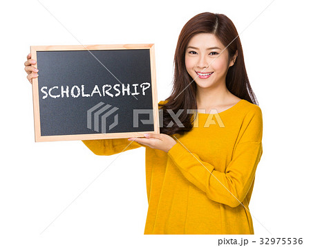 Young woman hand hold with the blackboard showing a word of scholarship 32975536