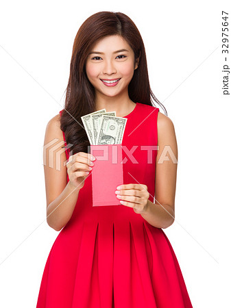 Asian young woman showing the red pocket with USD Asian young woman showing the red pocket with USD 32975647
