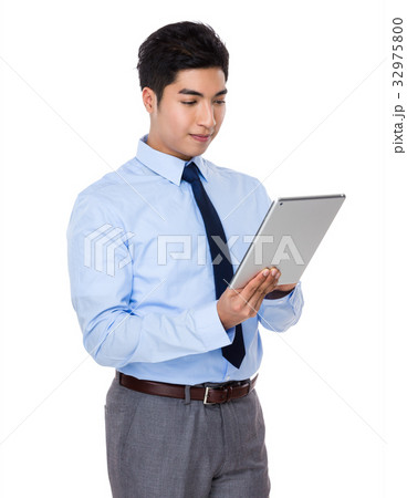 Asian businessman use of the tablet pc Asian businessman use of the tablet pc 32975800
