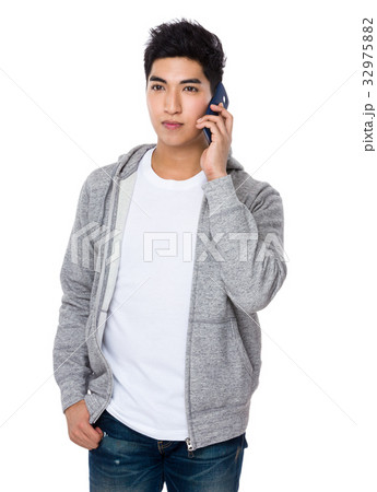 Young Man talk to cellphone Young Man talk to cellphone 32975882