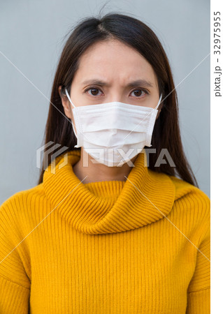 Woman feeling unwell and wearing face mask Woman feeling unwell and wearing face mask 32975955