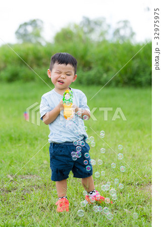 Cute little boy play with his toy 32975975
