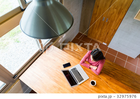 Top view of woman looking at the laptop computer Top view of woman looking at the laptop computer 32975976