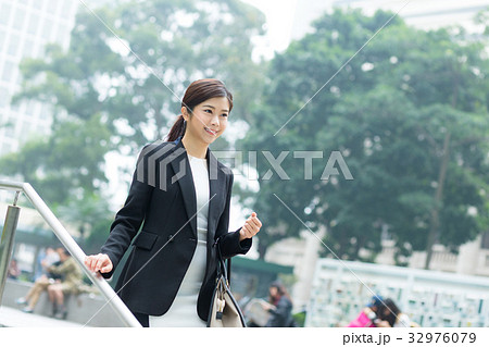 Businesswoman walking down the step 32976079