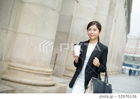 Young business woman walking outside 32976136