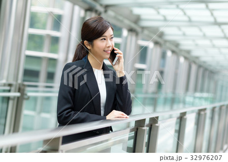 Young businesswoman talk on phone Young businesswoman talk on phone 32976207