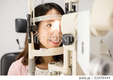 Woman undergo optical exam Woman undergo optical exam 32976444
