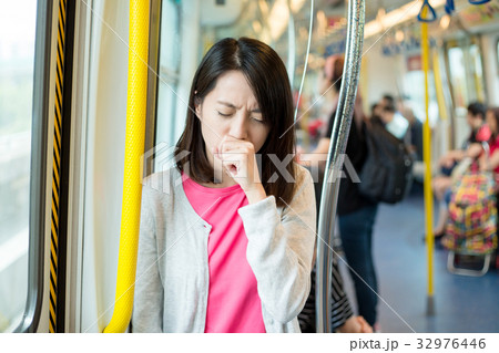 Woman feeling unwell inside train Woman feeling unwell inside train 32976446