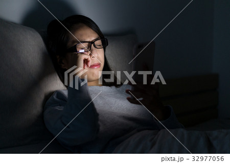 Woman feeling eye pain and use of mobile phone at home Woman feeling eye pain and use of mobile phone at home 32977056