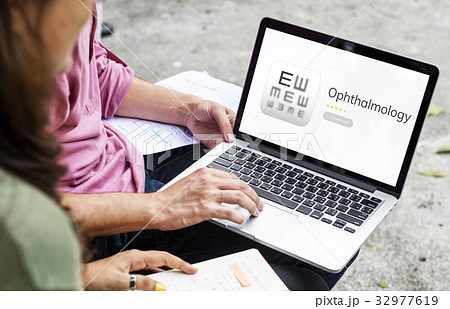 Couple working on laptop network graphic overlay Couple working on laptop network graphic overlay 32977619
