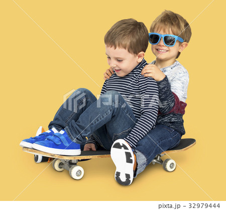Little Kids Smiling Playing Sitting Skateboard 32979444