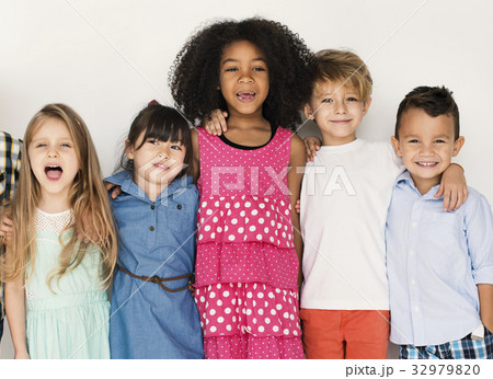 Diverse group of kids standing in a row portrait Diverse group of kids standing in a row portrait 32979820