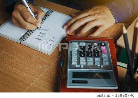hand Asian man calculate finances and accounting hand Asian man calculate finances and accounting 32980740