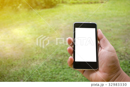 Soft focus of hand using mobile smart phone  32983330
